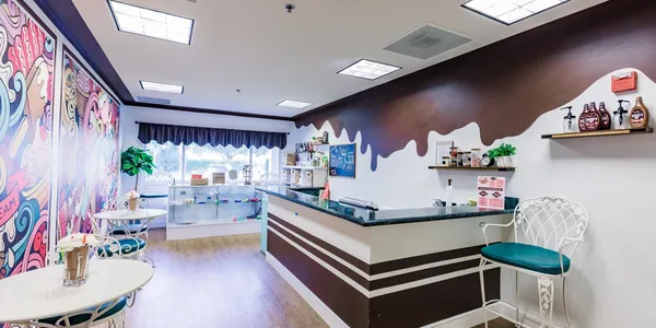 A view of an ice cream shop from the counter.